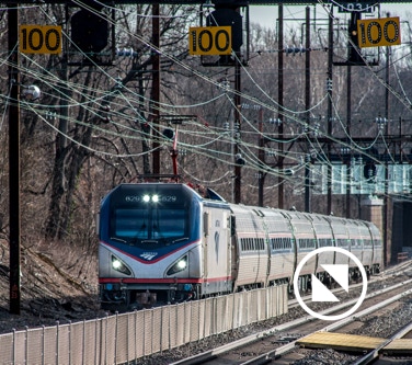 A non-stop Amtrak commuter flying through Halthorpe Station.