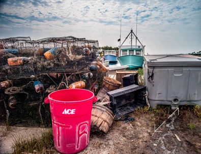 Crab pots and boats at dock